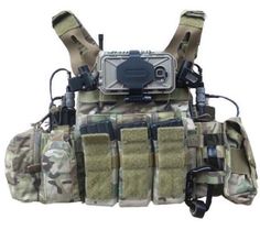 the chest rig is equipped with multiple pouches and an electronic device in one compartment