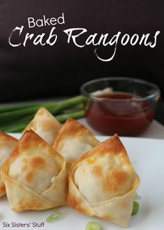 baked crab rangoons on a plate with dipping sauce