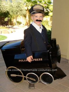 a young boy dressed as a police officer sitting in an old fashioned toy car costume