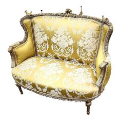 an ornately decorated couch is shown against a white background