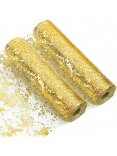 three rolls of gold glitter on a white background