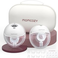 two baby monitors are sitting next to each other in front of a white case with the word momcozy written on it