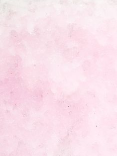 a pink and white background with some black dots on the bottom right corner in the center