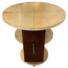 a wooden table with two circular bases on each side and an oval base on the other