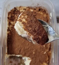 a spoonful of ice cream in a plastic container