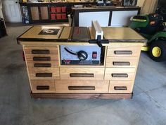 a workbench with many drawers and tools on it