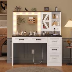 a white desk with drawers and lights on it