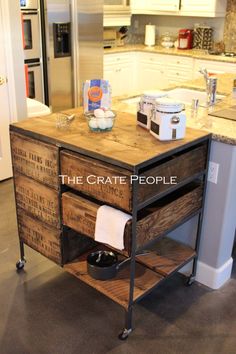 a kitchen island made out of pallet wood with an open drawer on the top