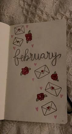 an open book with writing on it that says,'february'and envelopes