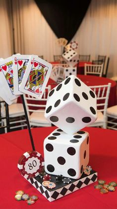 two dices are stacked on top of each other at a casino themed birthday party