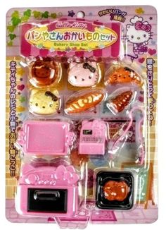 hello kitty kitchen accessories set in plastic package with pink and orange items on it's side