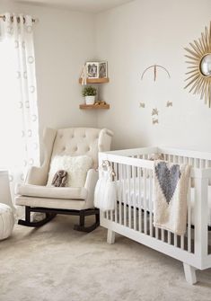 a baby's room with a rocking chair and crib