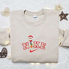 Introducing the Santa Claus x Nike Embroidered Sweatshirt, the perfect blend of festive cheer and athletic style. This limited edition sweatshirt features a meticulously crafted embroidery of Santa Claus, adding a touch of holiday magic to your wardrobe. The Nike Inspired Embroidered Shirt is a must-have for those who want to make a statement this Christmas. With its bold Nike-inspired design and intricate embroidery, this shirt is sure to turn heads wherever you go. Looking for the best Christm Nike Christmas, Disney Character Shirts, Nike Stuff, Mickey Cartoons, Vanellope Von Schweetz, Walt Disney Characters, Sweatshirt Ideas, Unique Sweatshirt, Mike Wazowski