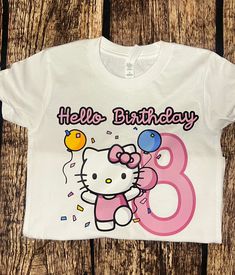 a hello kitty birthday shirt with the number eight on it