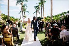 a bride and groom walking down the aisle after their wedding ceremony in palm springs, florida