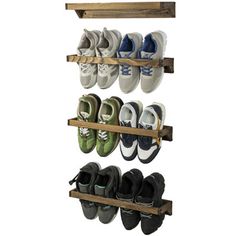 the shoe rack is made out of wood and holds several pairs of shoes on it