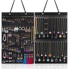 a black wall mounted jewelry organizer with multiple necklaces and earrings hanging on it's sides