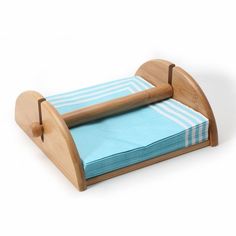 a wooden chair with blue and white striped napkins on it's back legs