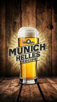 a glass of beer with the words munch helles here on it in front of a wooden background