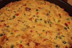 a cheesy dish is in a pan on the stove top and ready to be eaten