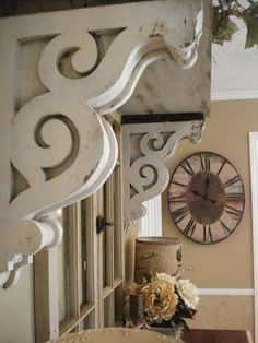 a mirror and clock on the wall in a room