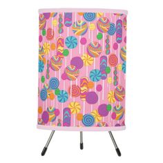 a pink lamp with colorful candies and lollipops printed on it's side