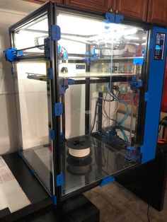 a machine that is sitting inside of a glass case