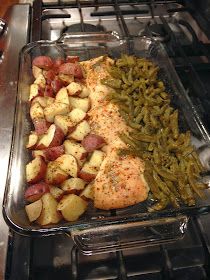 the meal is prepared and ready to be cooked in the oven, including chicken, potatoes, and green beans