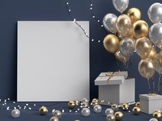 a white box surrounded by gold and silver balloons