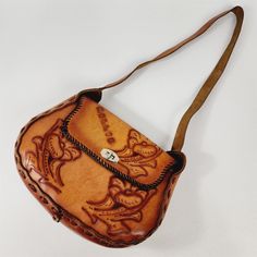 Good preowned condition, normal vintage wear, some surface wear & scratches. It measures 12" wide x 9" tallx  4" deep. Please see pictures for details. Retro Hand-tooled Bags, Vintage Brown Hand Tooled Bag, Vintage Hand Tooled Satchel For Daily Use, Vintage Hand Tooled Brown Shoulder Bag, Vintage Hand-tooled Travel Bag, Vintage Hand Tooled Travel Bag, Vintage Leather Shoulder Backpack, Vintage Canvas Shoulder Bag, Vintage Leather Backpack Shoulder Bag