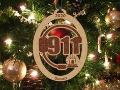 a wooden ornament hanging from a christmas tree