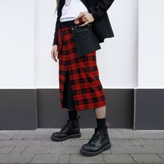 That perfect, large, brutal, minimalist red - not wine-colored, not multicolored, but black and red - scottish plaid. We hunted down this fabric to make the "Punk" model exactly how it should be - bold, bright and grunge. It has an asymmetric cut, large functional pockets, and lots of metal eyelets for additional accessories like chains, carbines, trinkets etc.  It has two large asymmetrical pockets, one of which fastens with a zipper. The basic fabric doesn't crease, it's quite dense and low-ma High Waisted Tartan Skirt, Red Punk Style Skirt, Red Tartan Pencil Skirt, Red Tartan Skirt, Red Plaid Skirt Outfit Grunge, Punk Tartan Skirt, Punk Man, Modern Kilts, Tartan Clothing