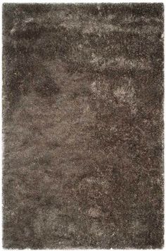 a brown area rug on top of a white floor