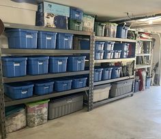 the shelves are filled with plastic containers and bins