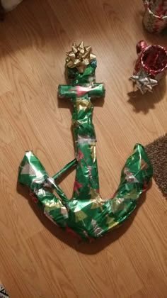 an anchor made out of wrapping paper on the floor