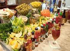 a table filled with lots of different types of food and drinks on top of it