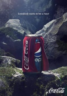 a can of coca - cola on top of a mountain