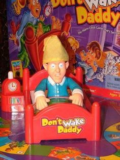 a toy that is sitting on top of a table with the words don't wake daddy