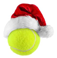 a tennis ball with a santa hat on it