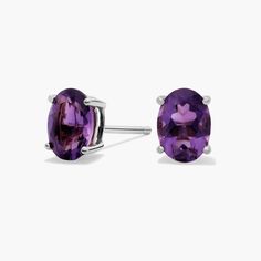 Pop on a pair of these classic oval cut amethyst stud earrings to add color to any outfit. With handcrafted 14k gold settings, these oval amethyst studs are as durable as they are stylish. Purple Oval Fine Jewelry Earrings, Classic Oval Purple Jewelry, Classic Oval Amethyst Jewelry, Classic Oval Shaped Amethyst Jewelry, Classic Amethyst Oval Jewelry, Amethyst Studs, Precious Gemstones Jewelry, Purple Earrings, Semi Precious Gemstones