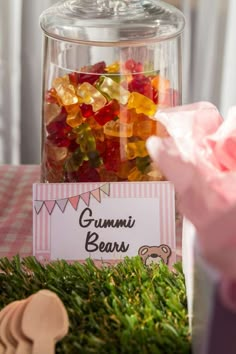 there are many gummy bears in the glass jar