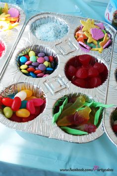 the trays are filled with candy and candies