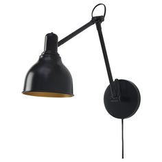 a black wall light with a wooden arm and an adjustable lamp shade on the side