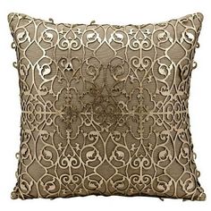 a decorative pillow with an intricate design on the front and back, made from linen