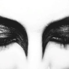 black and white photograph of woman's eyes with long lashes