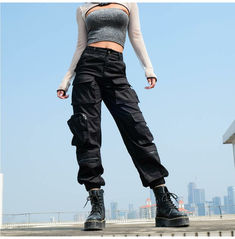 Show off your street style with our women's black high waist multi pocket cargo jogger pants. crafted from polyester for a comfortable fit, these pants are perfect for a casual urban look. shop now and get free shipping on all orders. Womens Black Cargo Pants, Black Cargo Pants Women, Celana Jogger Wanita, Look Grunge, Combat Trousers, Streetwear Pants, Baggy Cargo Pants, Pants Women Fashion, Black Cargo Pants