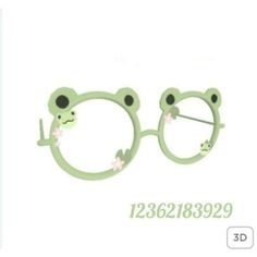 a pair of green glasses with frog faces on the front and side of each eye