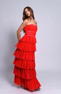 Strapless multi tiered pleated tulle maxi gown Bodice trim detail Fabric: Tulle Lined Center back zipper from HPS Dry clean only Funky Bridesmaid Dresses, Pink And Red Bridesmaid Dresses, Cruise Fits, Witch Life, Orange And Pink Wedding, Orange Gown, Bridesmaid Tulle, Tiered Gown, Red Formal Dresses