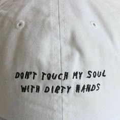 a white hat with black writing on it that says, don't touch my soul with dirty hands