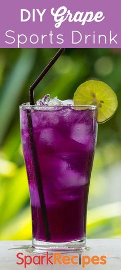 a purple drink in a tall glass with a lime slice on the rim and text that reads diy grape sports drink